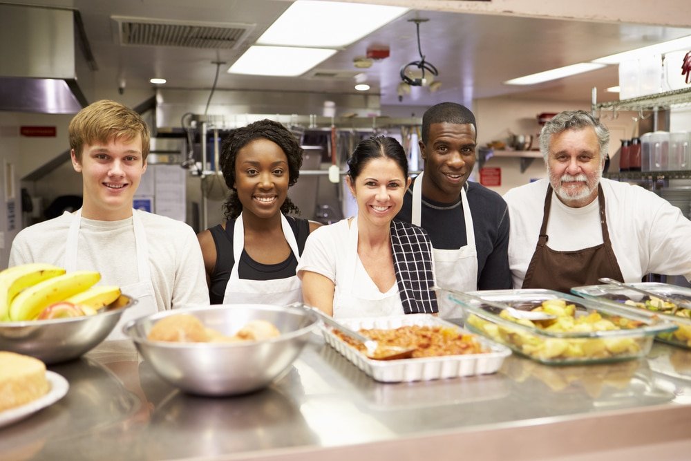 Portrait,Of,Kitchen,Staff,In,Homeless,Shelter