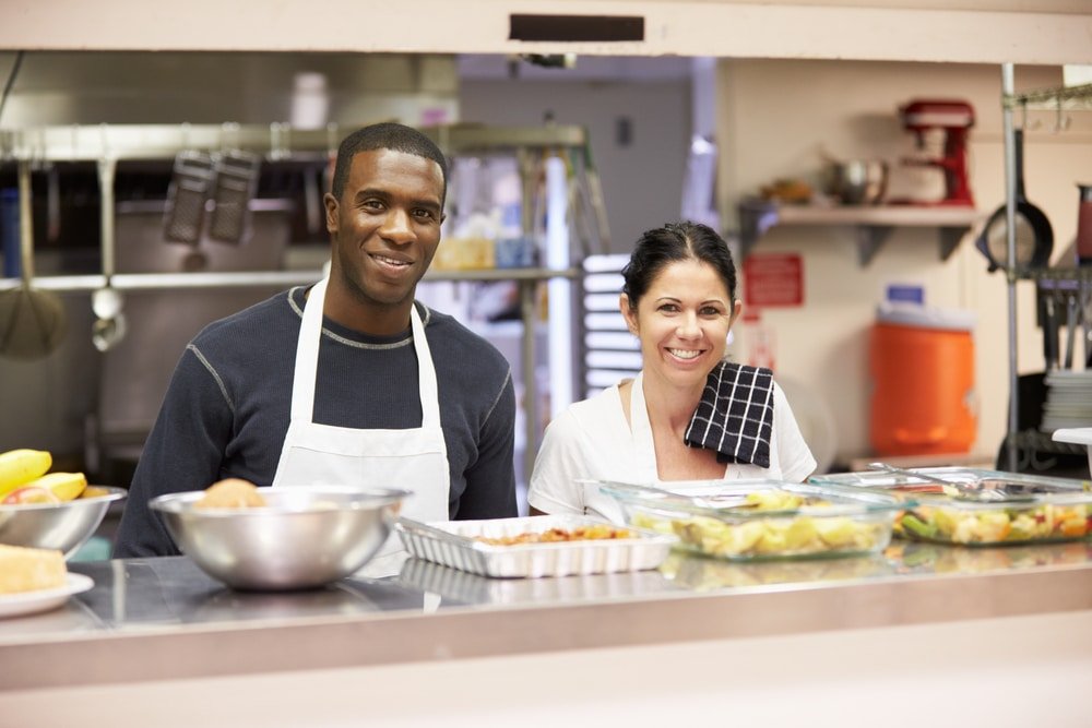 Portrait,Of,Kitchen,Staff,In,Homeless,Shelter