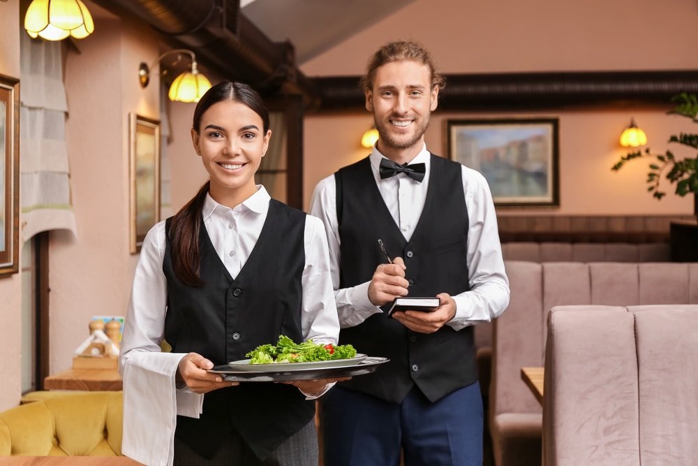 Portrait,Of,Young,Waiters,In,Restaurant